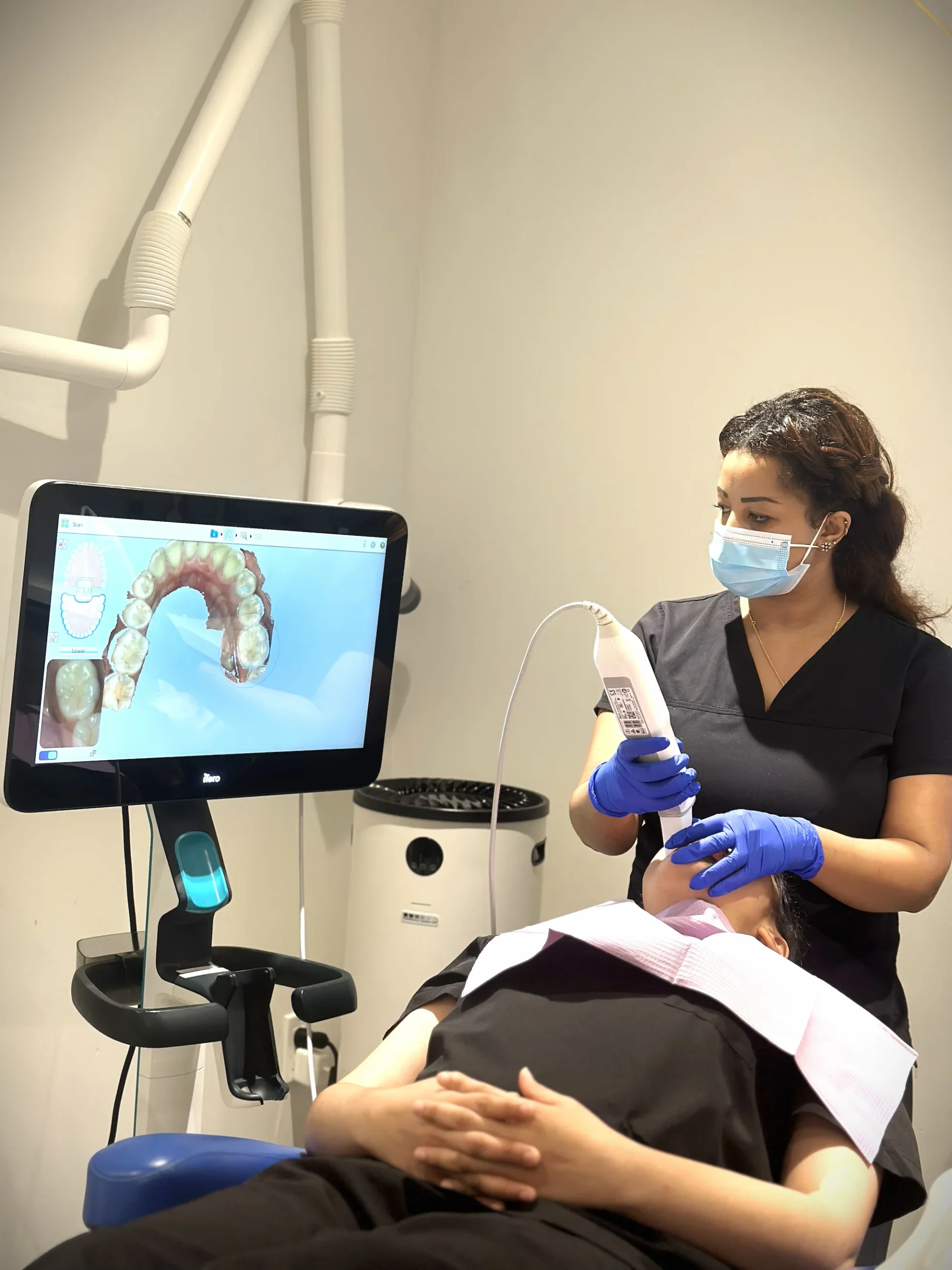 Dental professional using an intraoral scanner during patient care