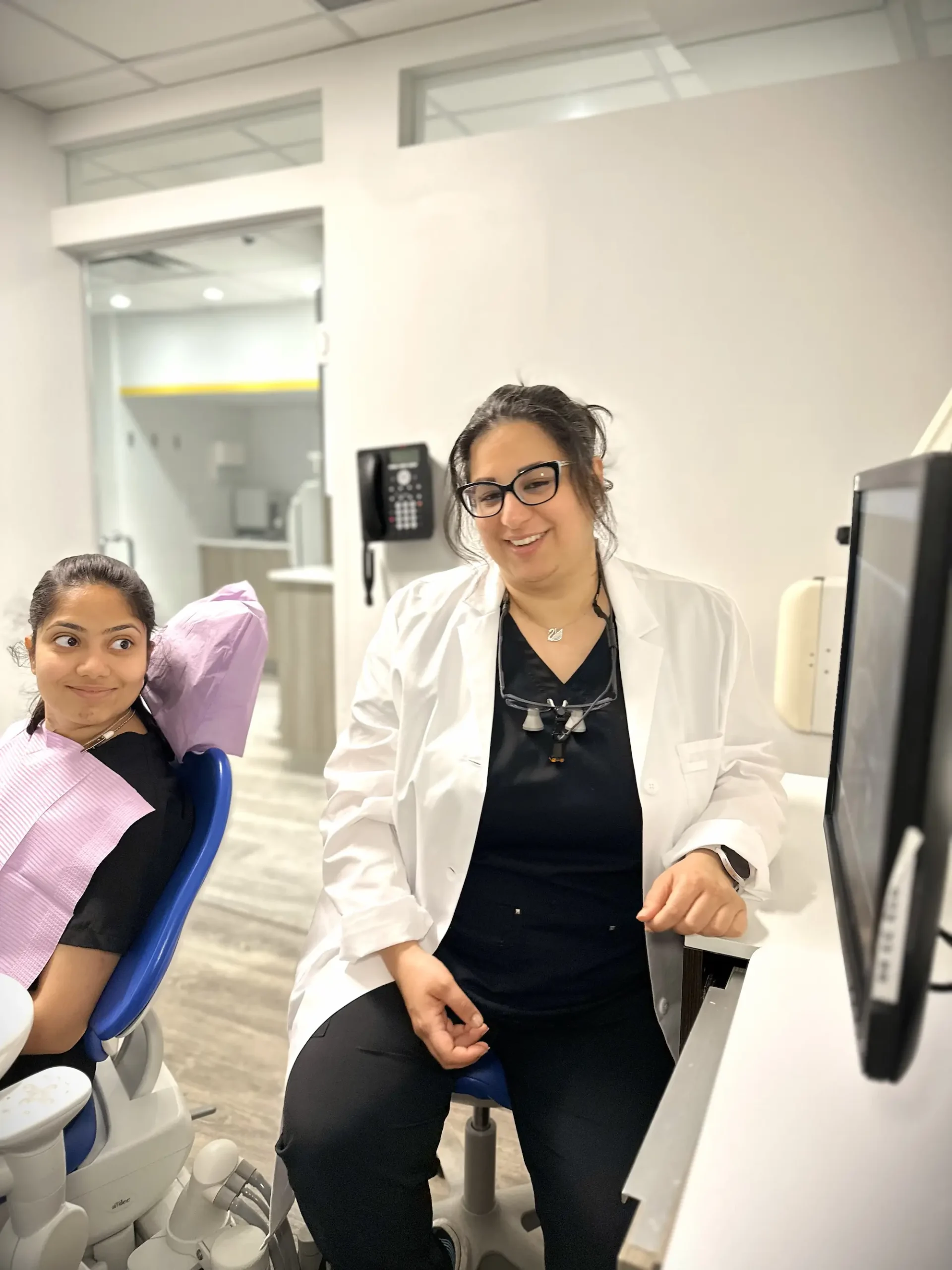 Dentist and patient in a Hayden Charles Dental Care treatment room