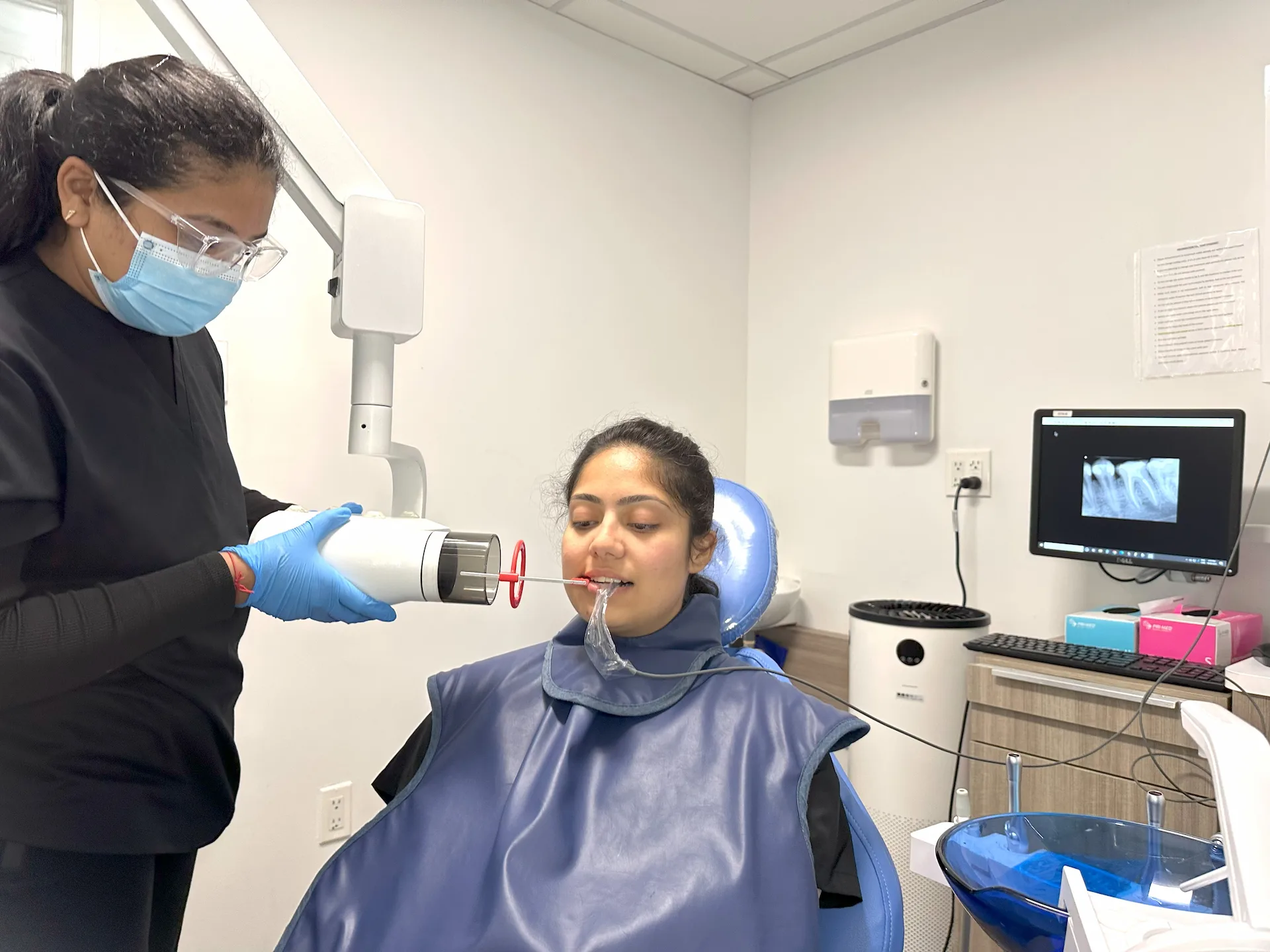 Dental professional performing an intraoral scan