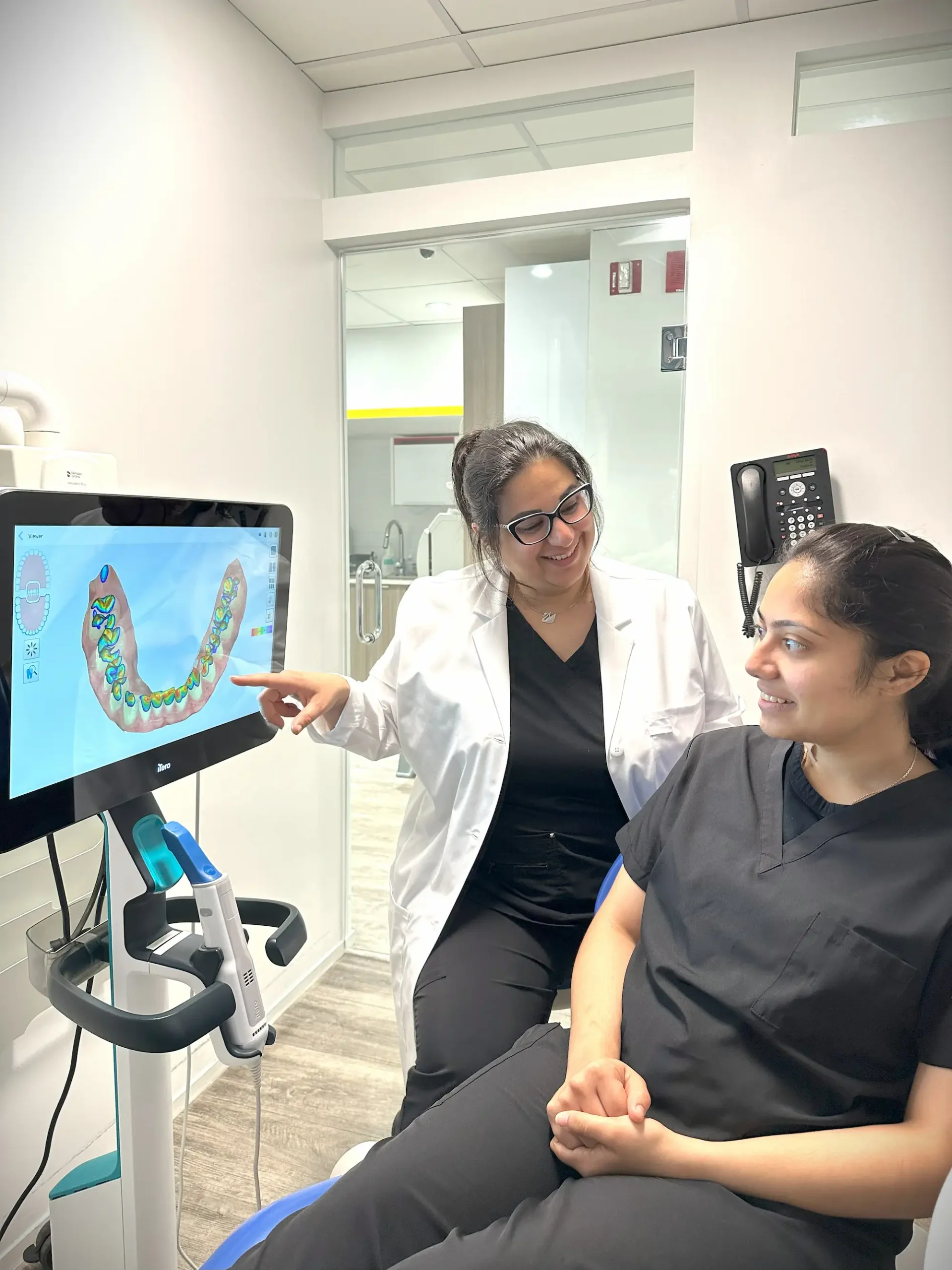 Dentist showing a patient a digital intraoral scan