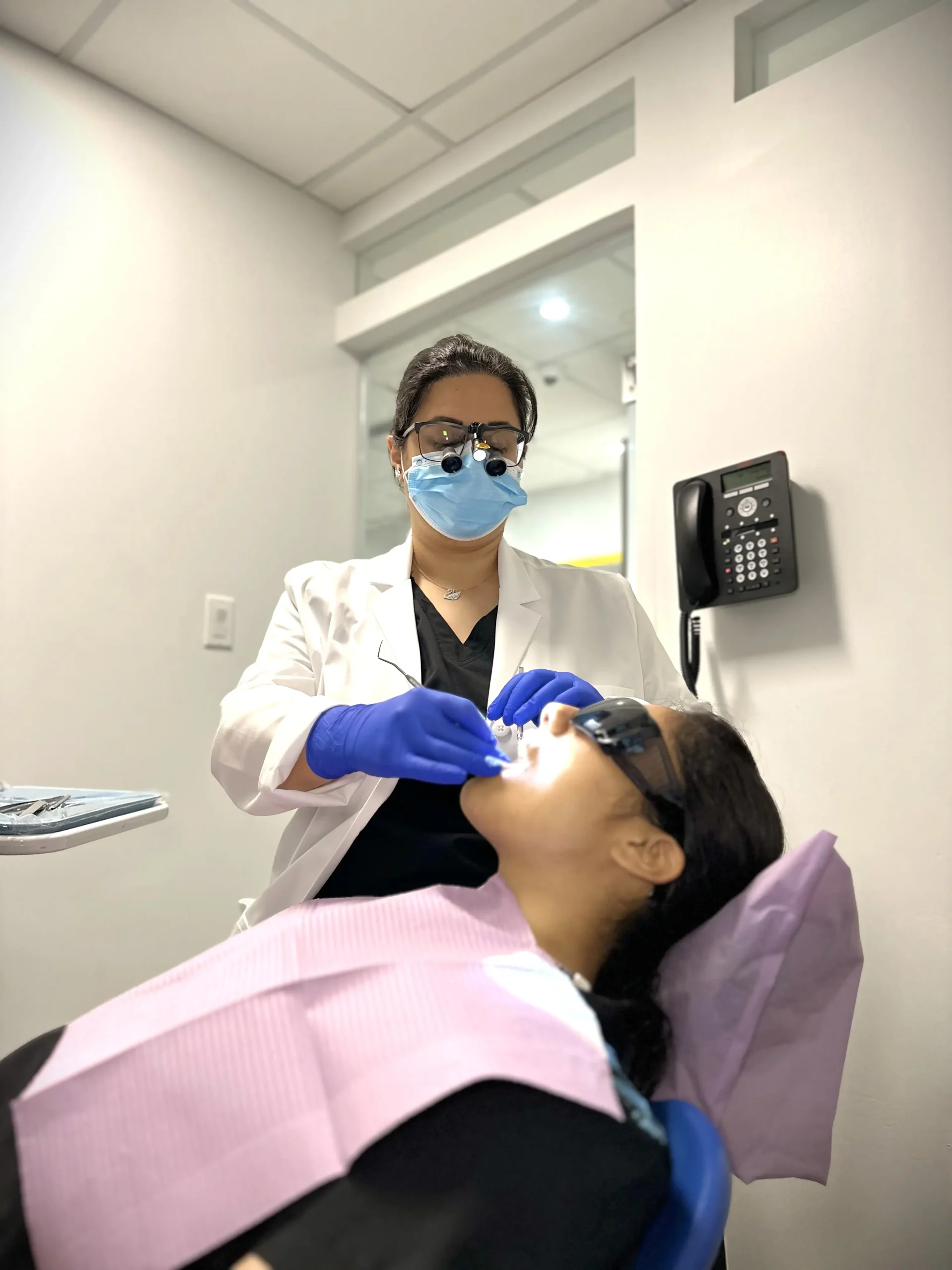 Dentist providing care to a patient at Hayden Charles Dental Care